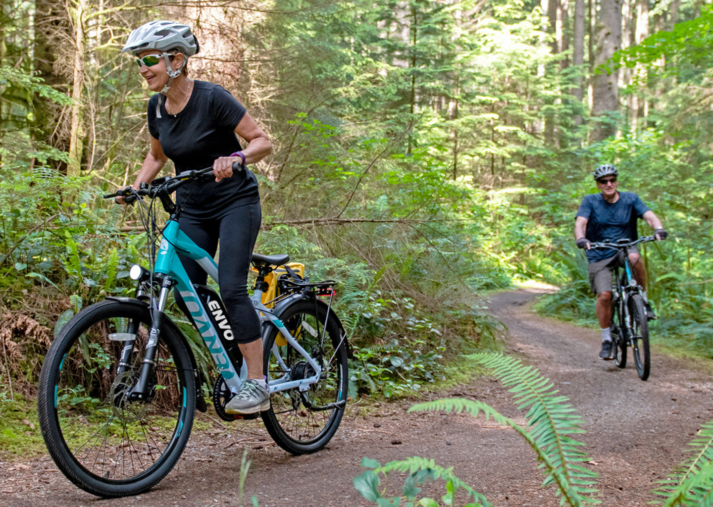 Girl riding ebike ENVO d35 through the forest